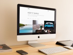 Desktop with Mac PC showing website using WordPress theme Mello by ThemeTrust.
